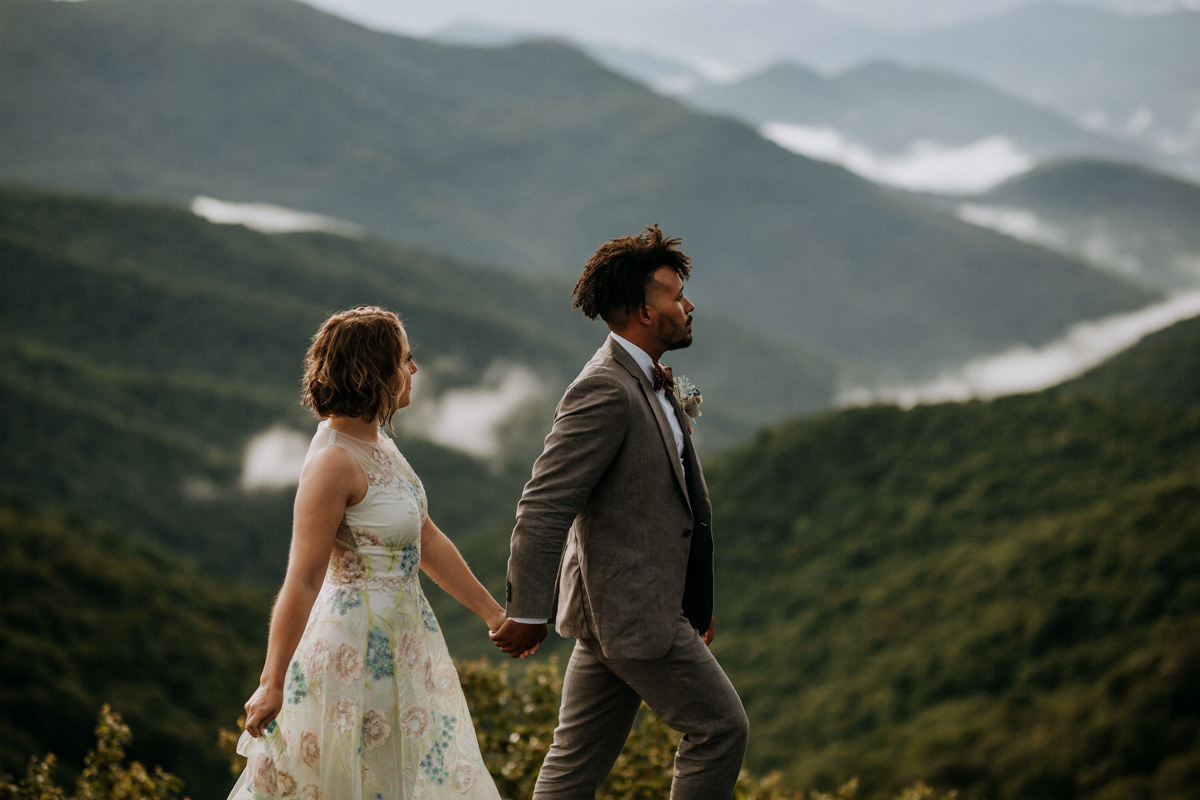 Asheville elopement image of a wedding couple overlooking the mountains at Craggy Gardens in Asheville North Carolina.