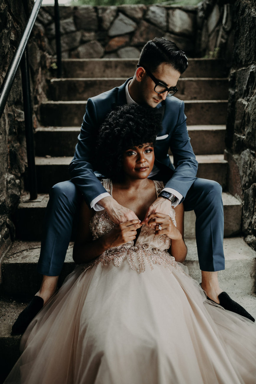 An Asheville elopement photographer captured a beautiful image of an interracial couple on their wedding day. The image can be clicked to see more of the photographer's portfolio.