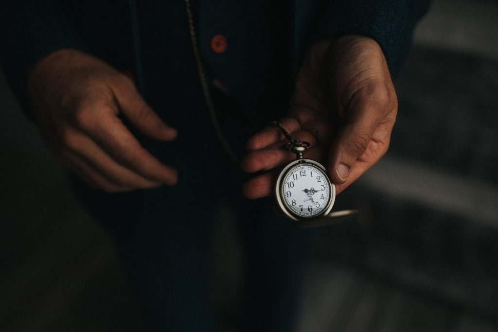 An Asheville wedding photographer has taken a picture of someone holding out a pocket watch to indicate that they are about to get married. The image is to encourage people to get in touch.